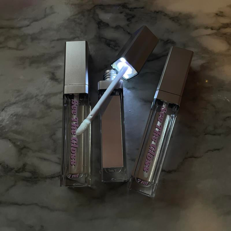 Viral Strawberry Lip Gloss with Light & Mirror – “See the Gloss” High-shine, sweet scent, and a built-in mirror with LED light for effortless touch-ups. Your lips, but glossier.